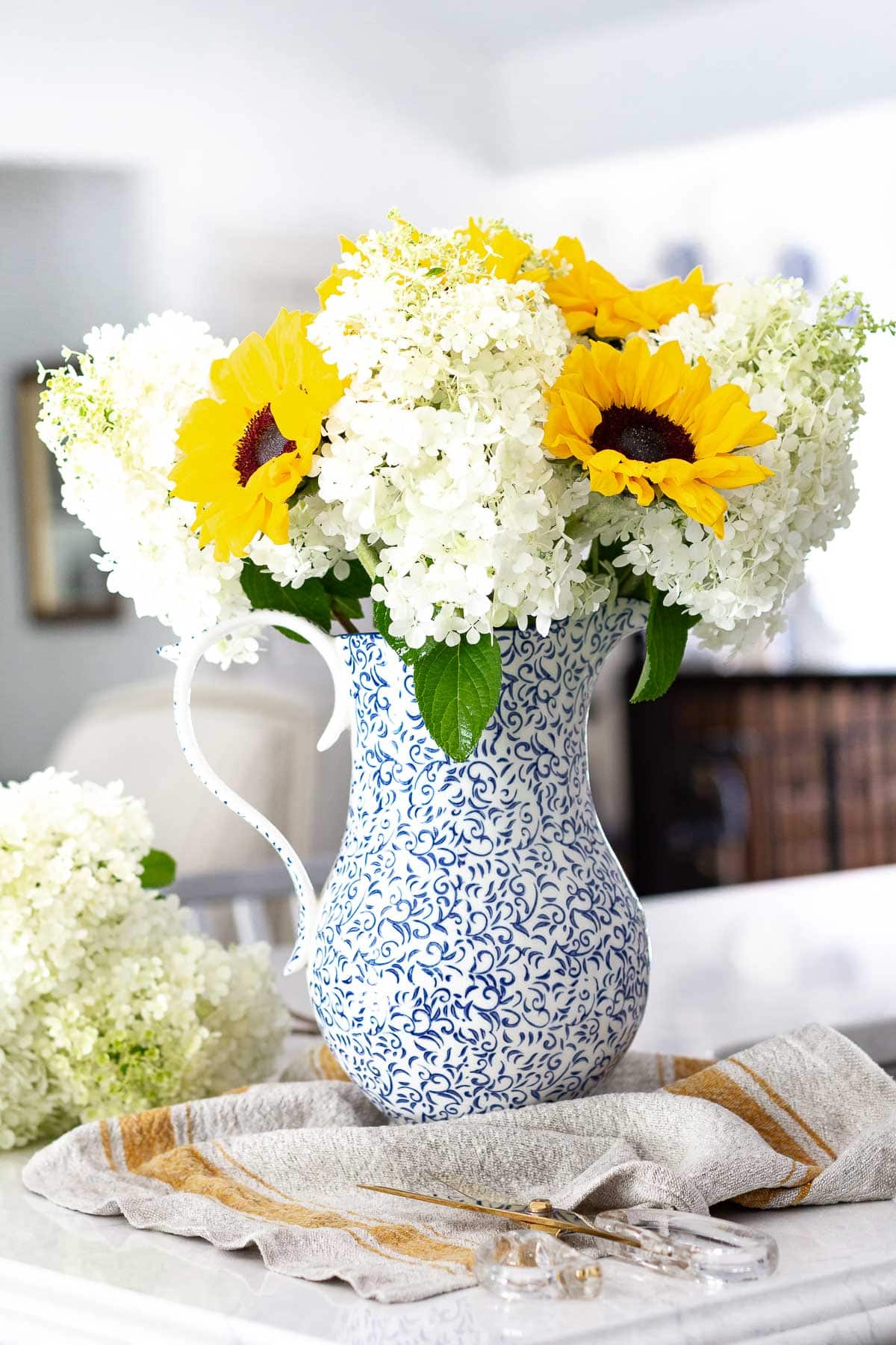 sunflower and hydrangea arrangement on kitchen counter