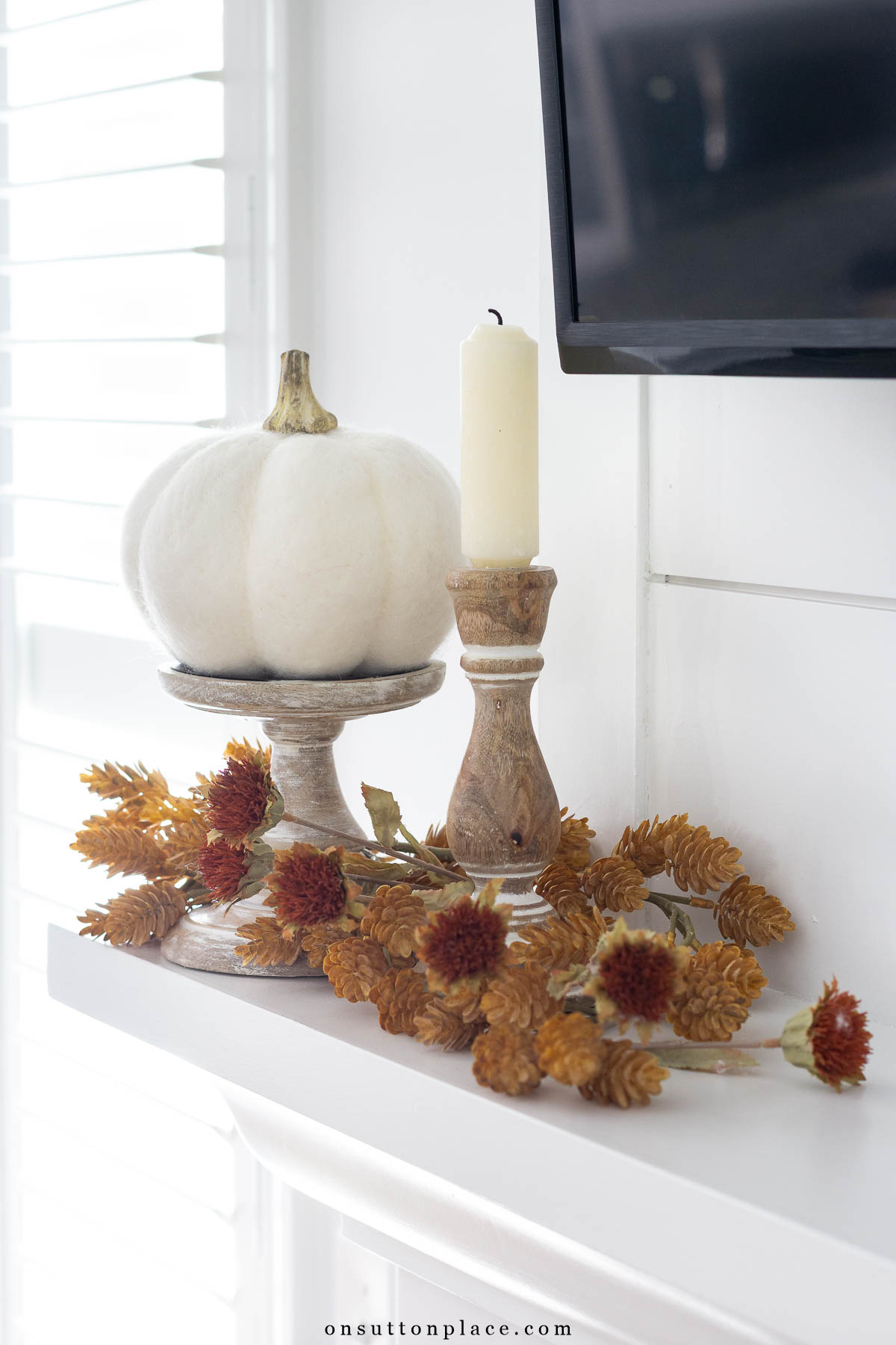 mantel fall vignette idea with faux pumpkin and candle