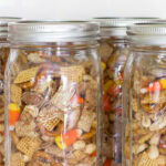 sweet chex mix recipe in mason jars tall pin