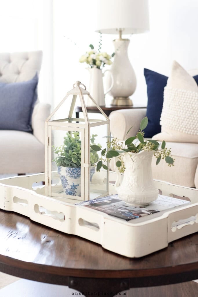 coffee table decor ideas tray with books and lantern 2025