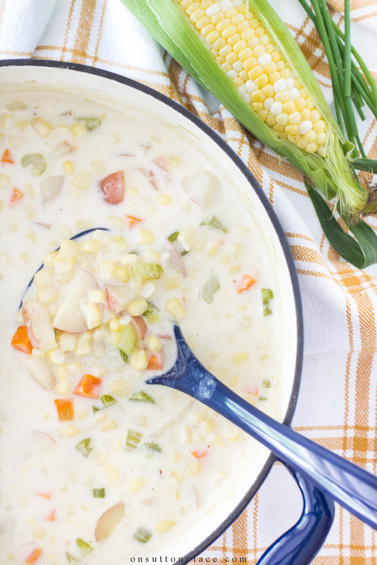 corn chowder recipe in blue pot with ear of corn 2024