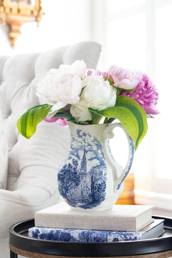 pink and white peony flower bouquet in blue and white pitcher