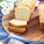 sliced loaf of banana bread on round wood board 2025