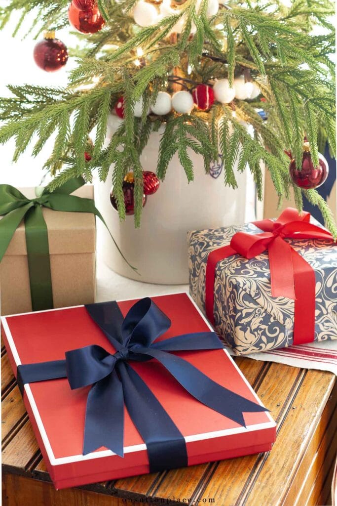 wrapped Christmas gifts under tabletop tree