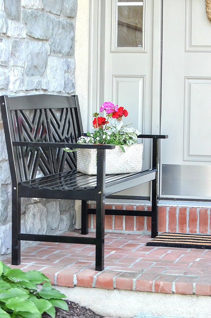 front porch with black wood bench stonegable hss