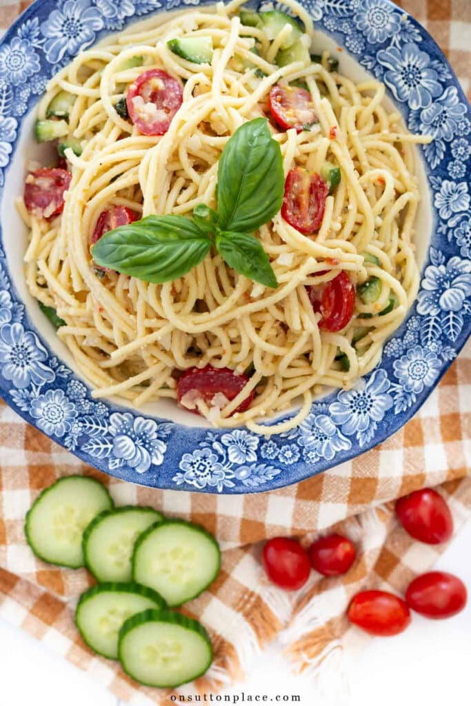 cold spaghetti salad recipe in blue transferware bowl
