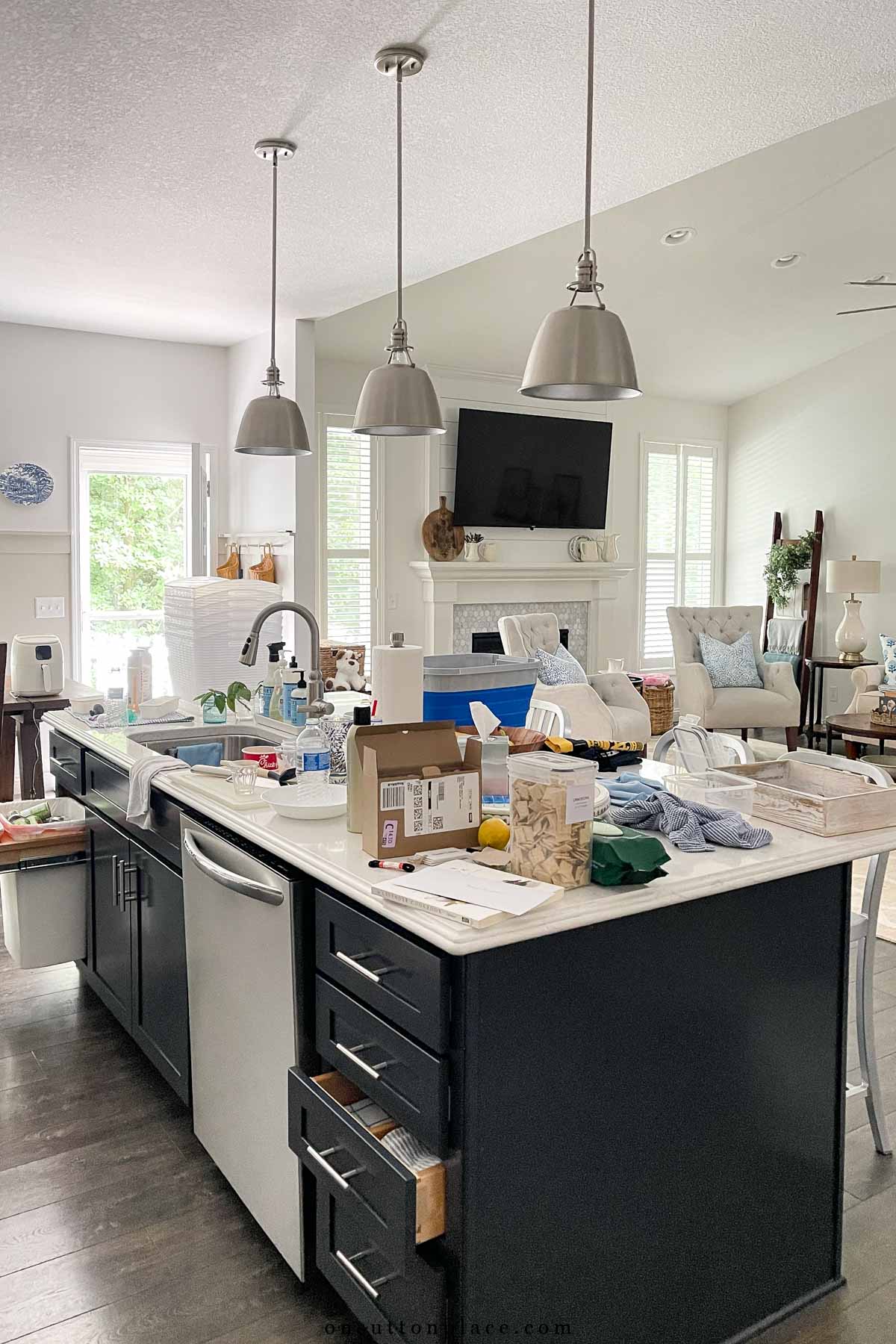 kitchen island with clutter and dishes
