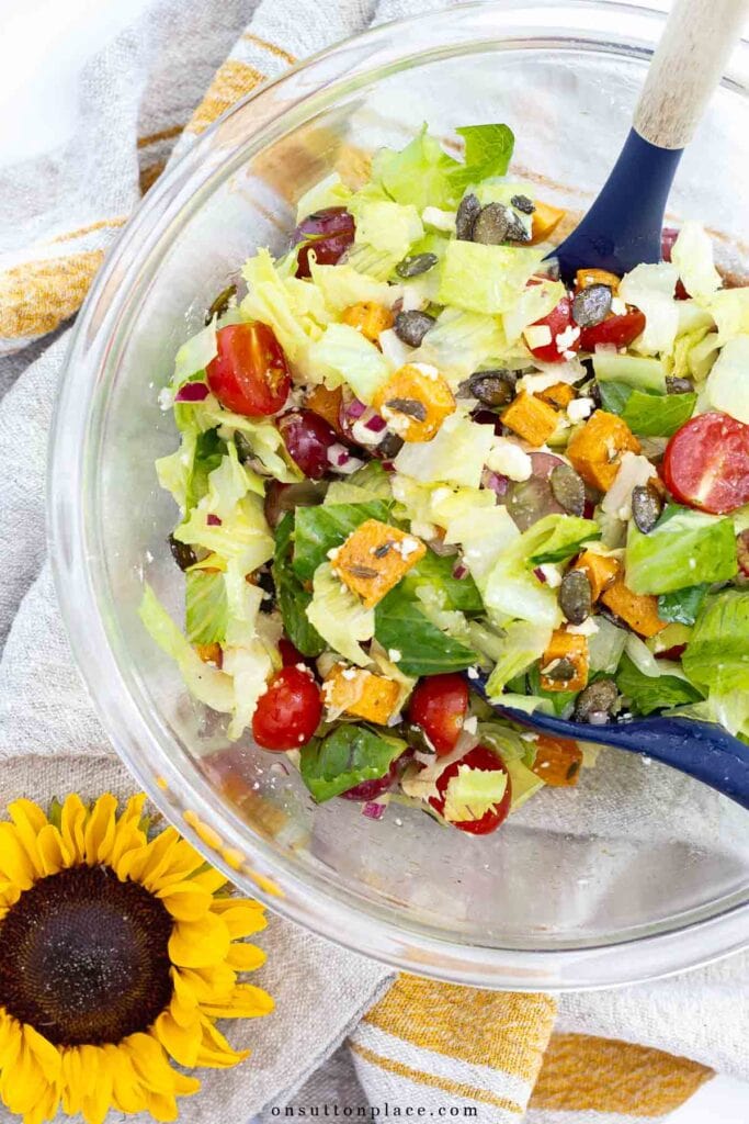 autumn romaine lettuce salad in large bowl with sunflower