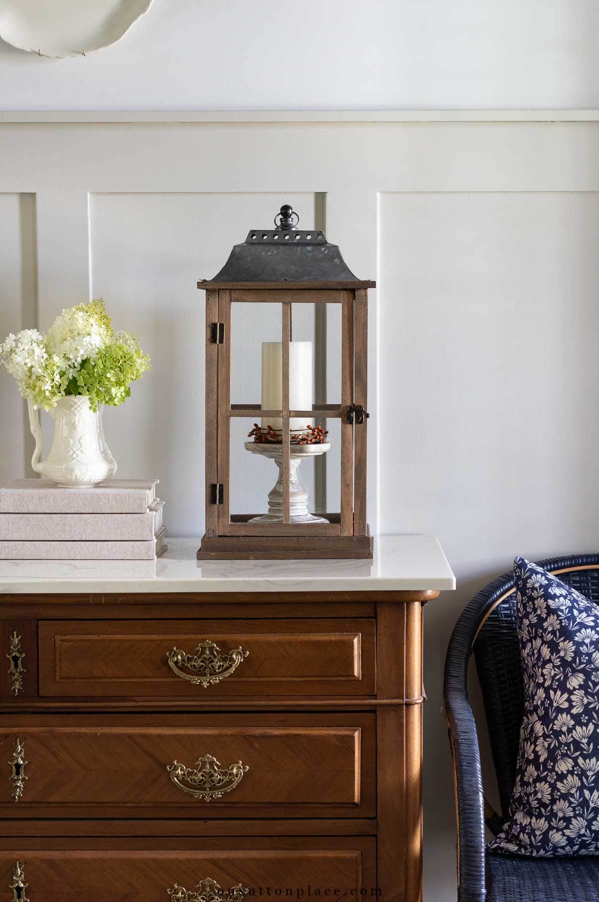 foyer decorating with lanterns, candles, books, flowers
