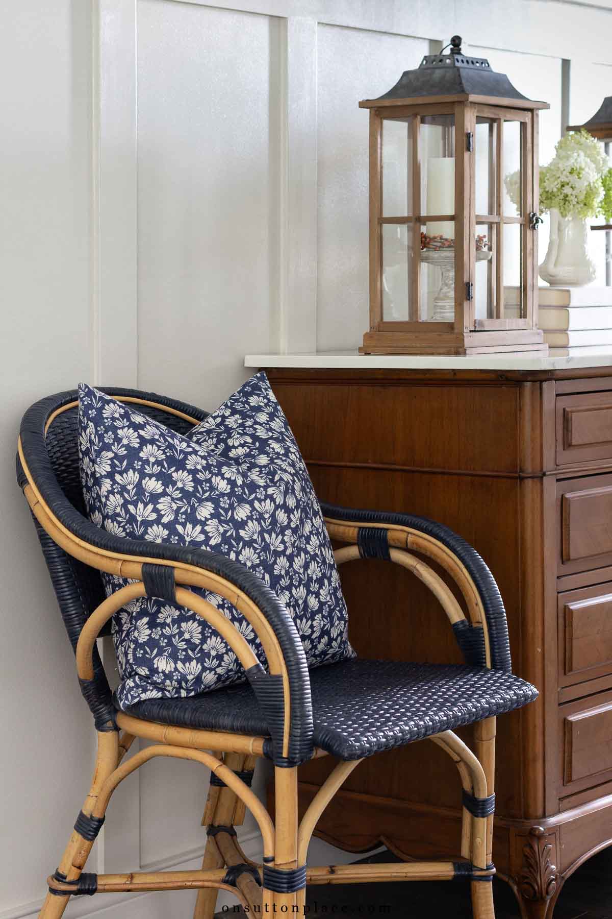 wicker armchair with block print pillow foyer decorating ideas for fall