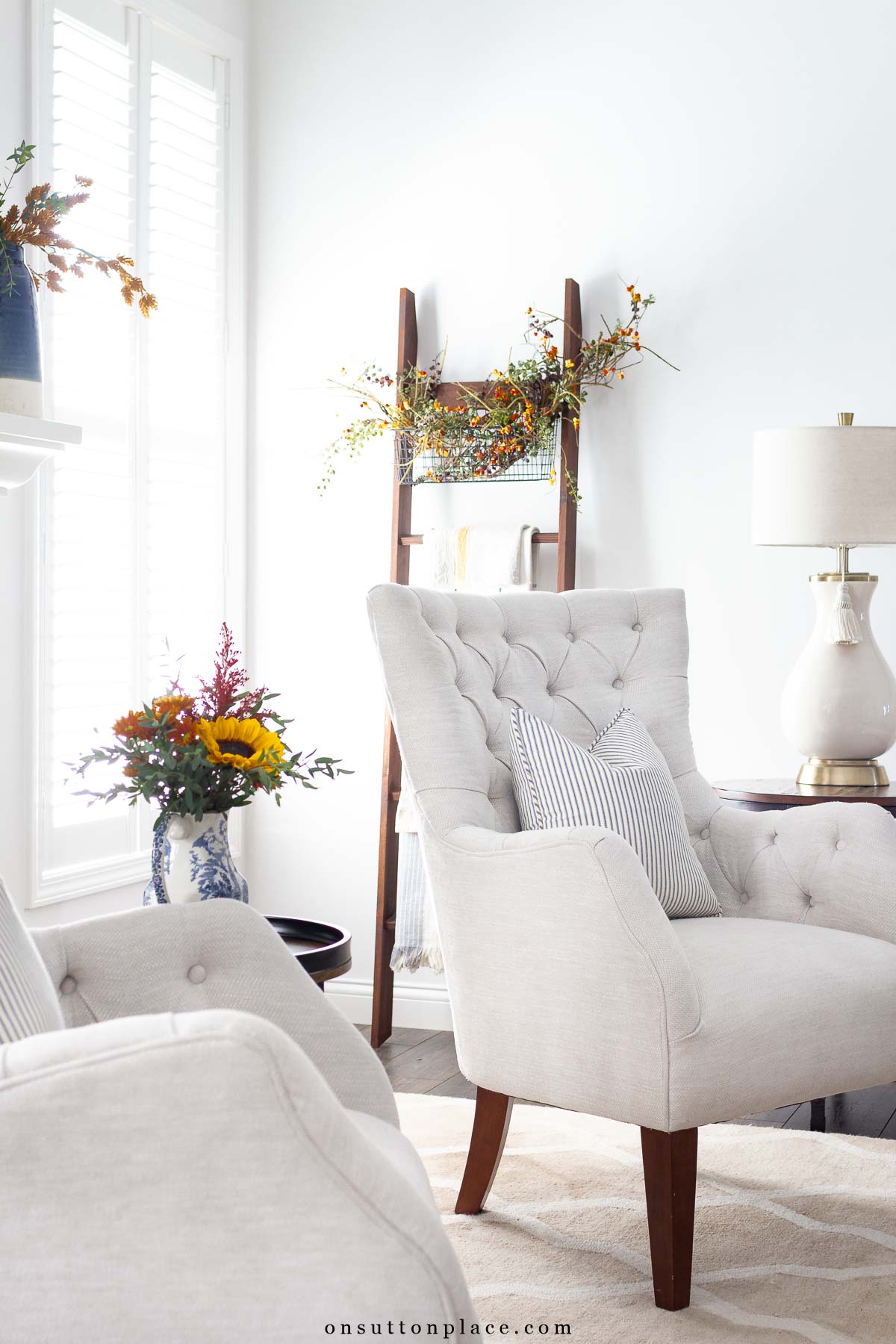 blue ticking pillows and gold tones styled together for fall decor