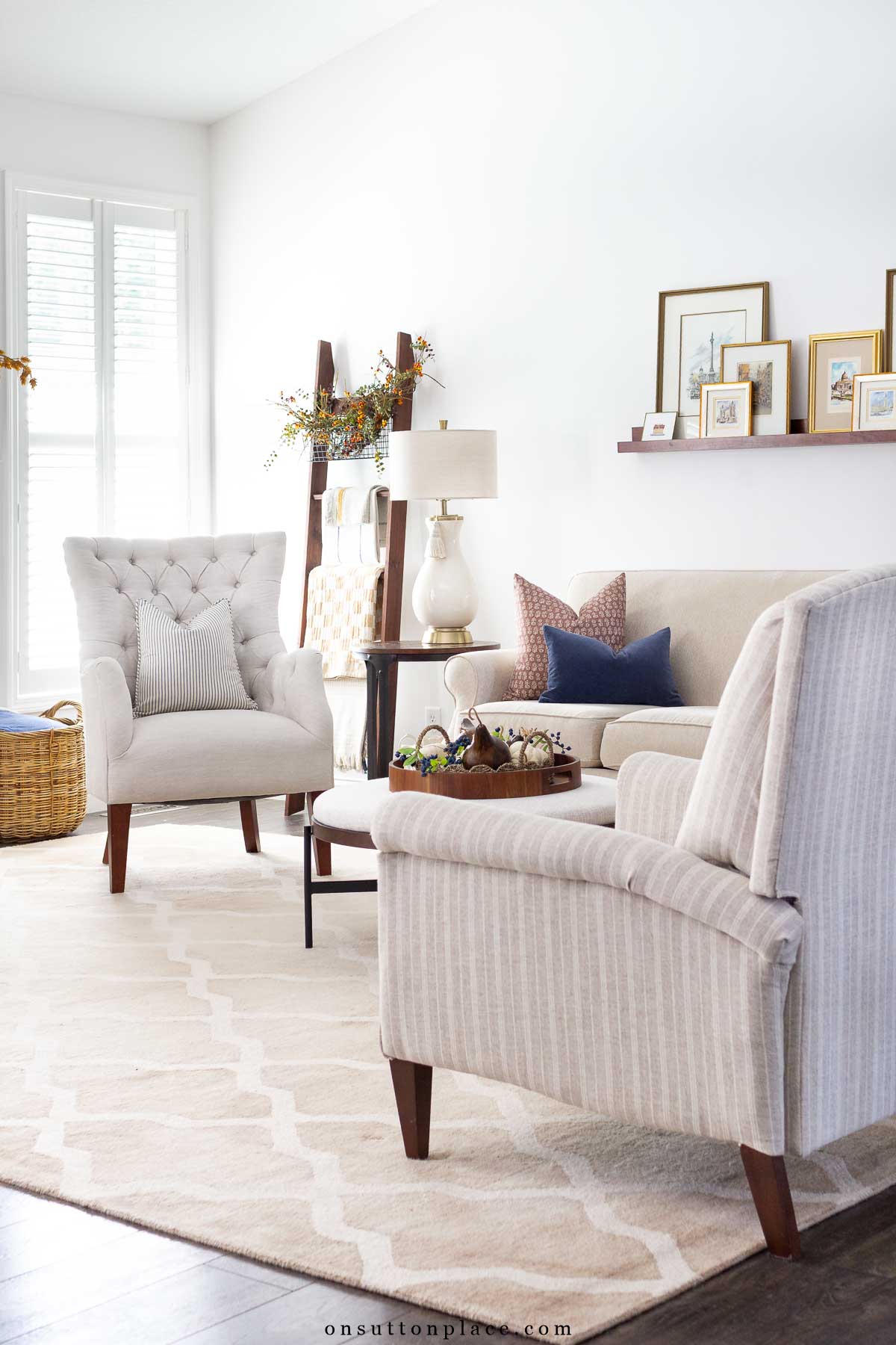 cozy living room decorated for fall with blue and gold accents