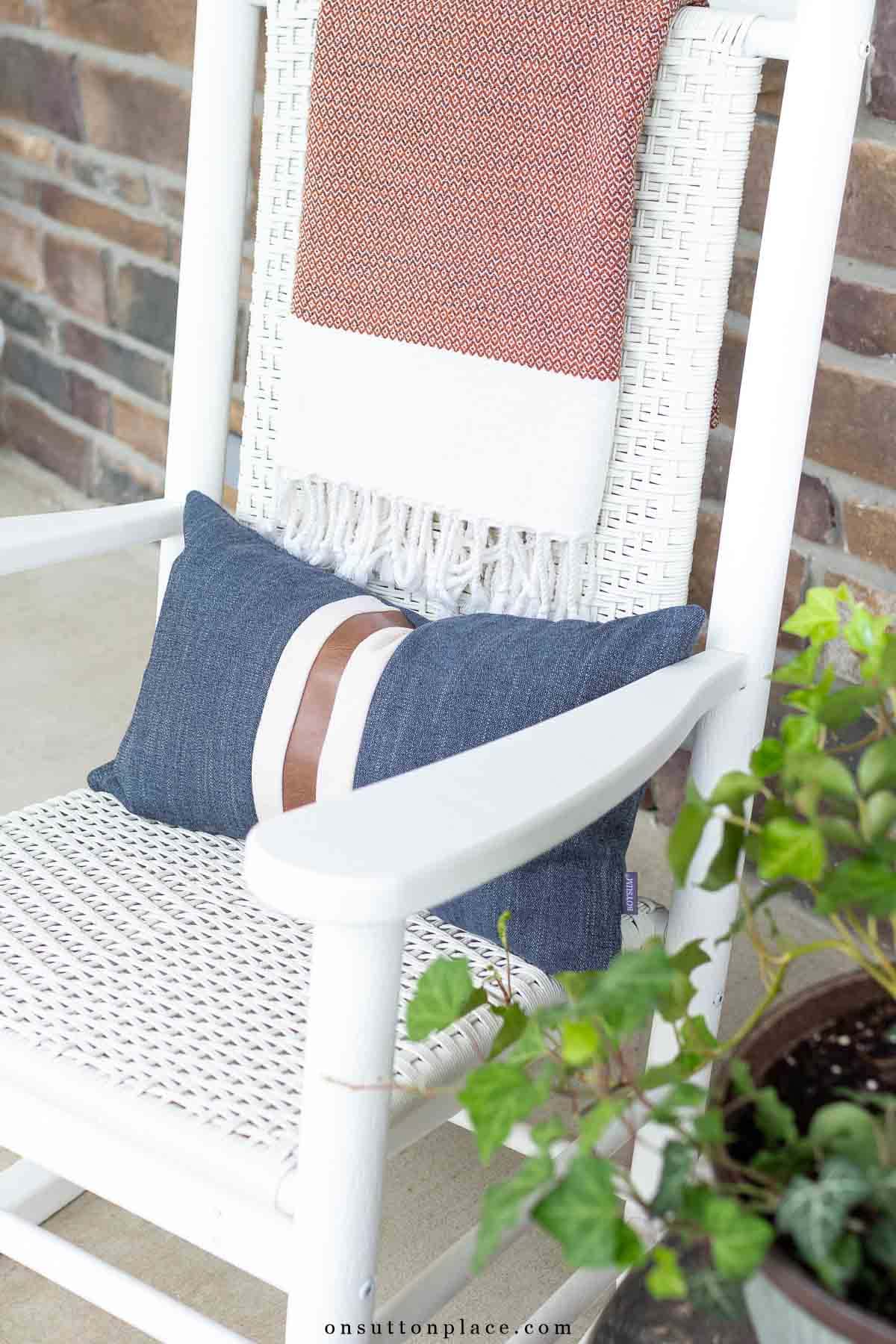 denim pillow and throw blanket on porch rocker-4
