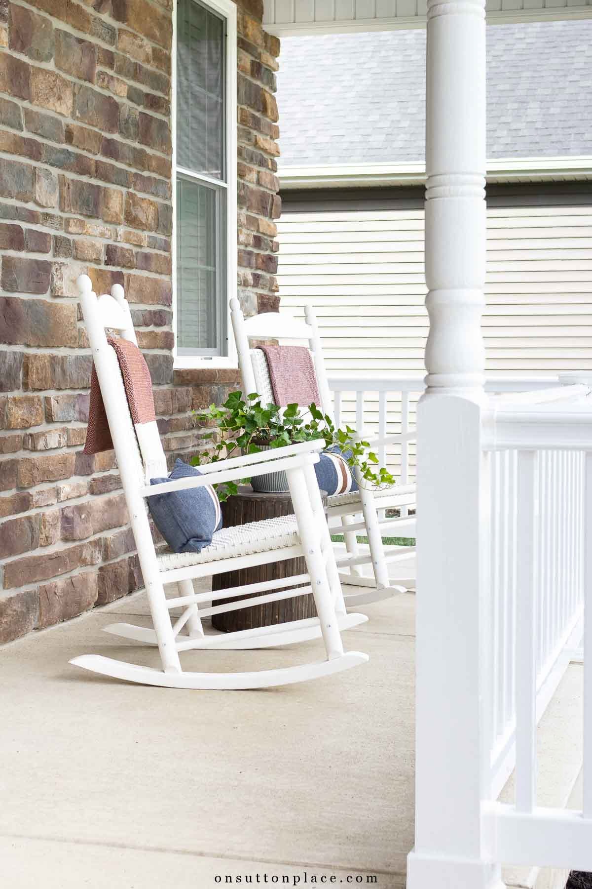 front porch white railing fall decor on rockers-16