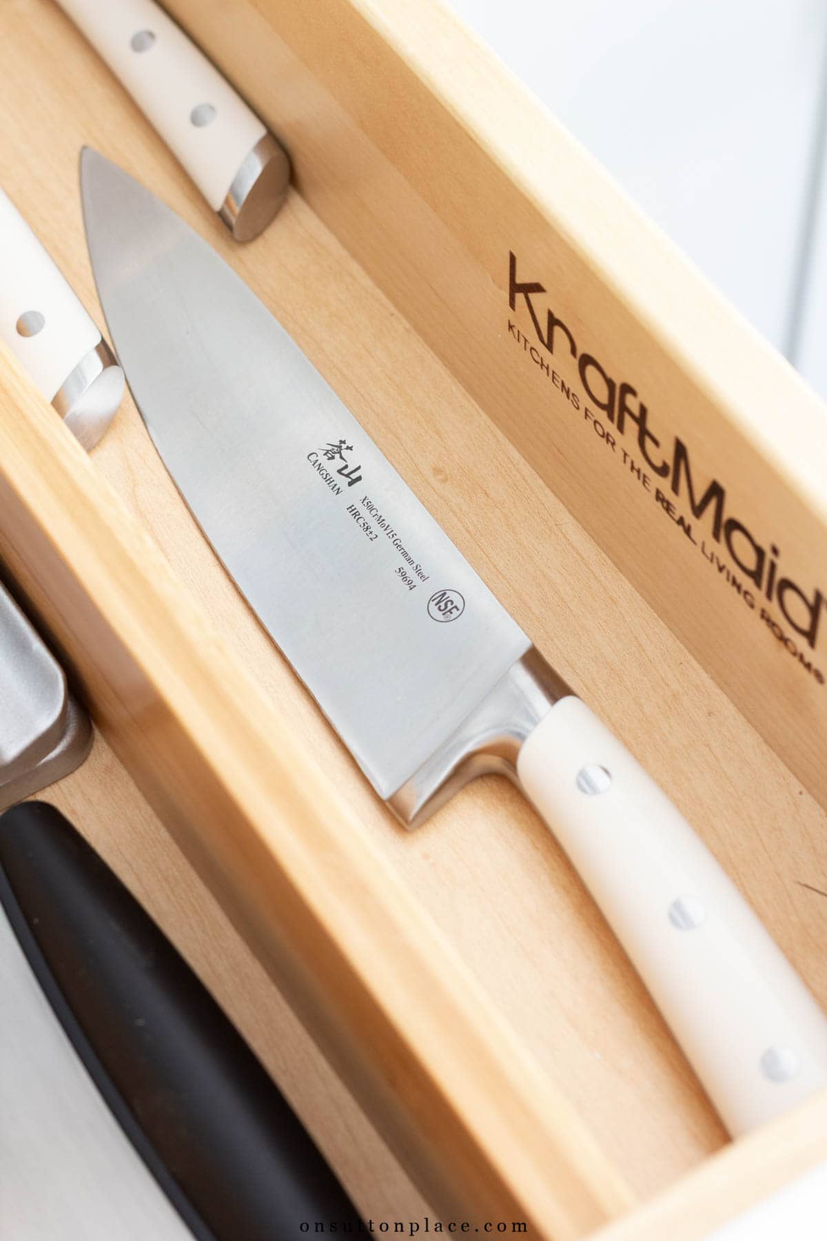 chef's knife in organized drawer minimalist kitchen essentials