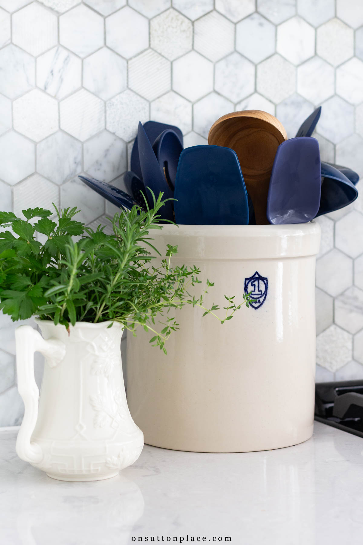 crock of utensils minimalist kitchen essentials