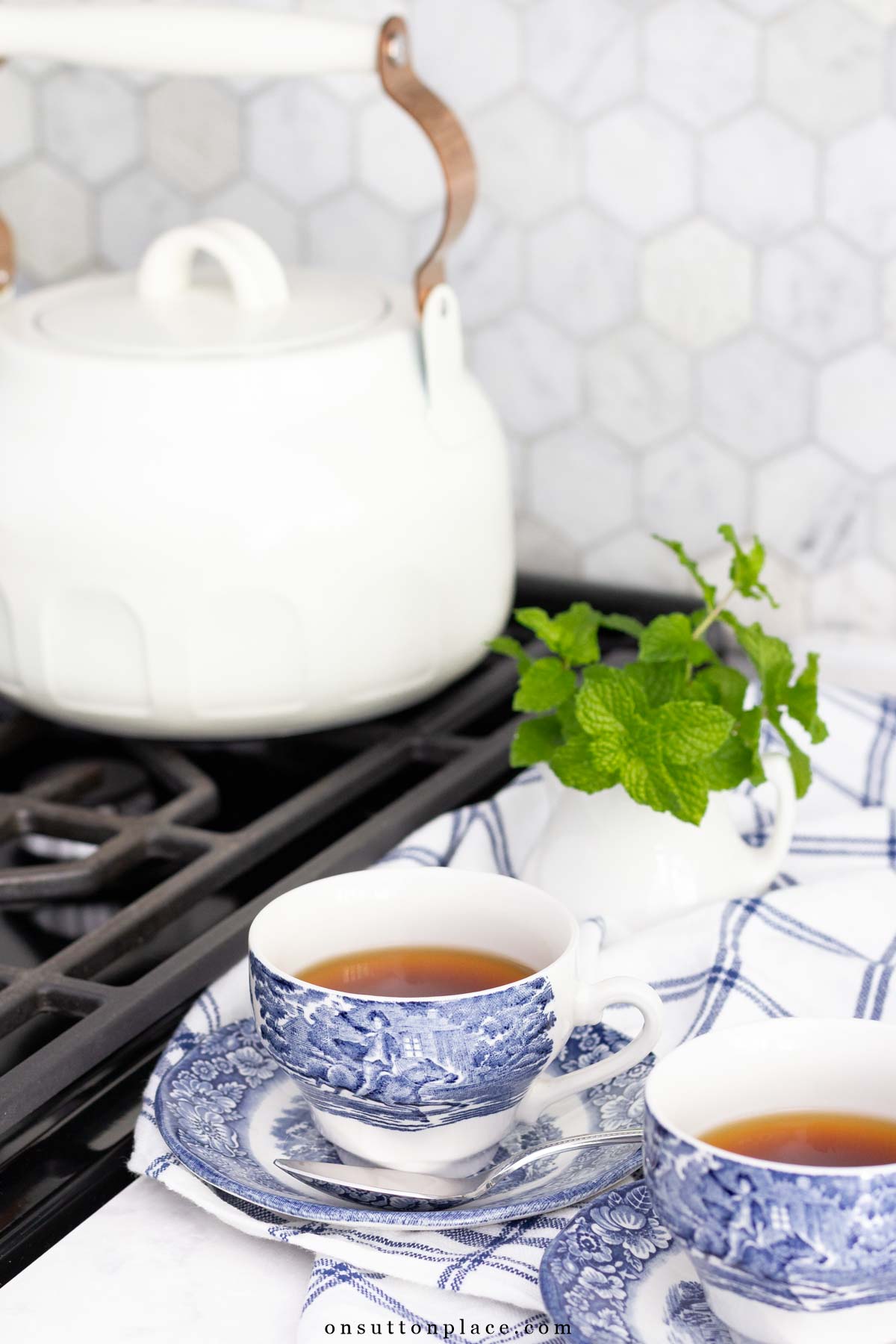 simple living in autumn tea kettle on stove with teacups