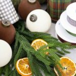 Christmas decor ideas norfolk pine dried orange slices ornaments ribbon