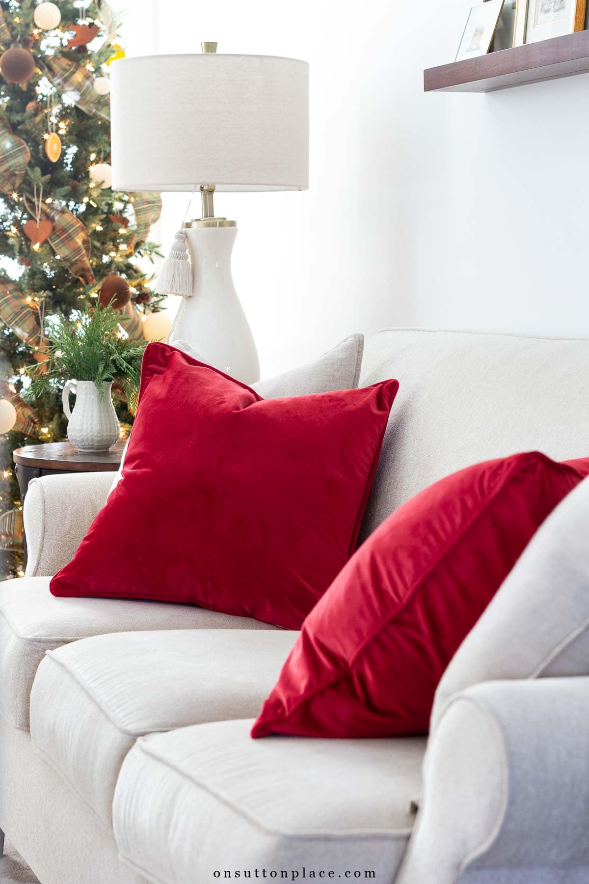 Christmas decor neutral sofa with red pillows