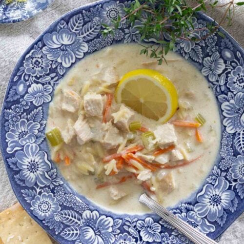 creamy lemon chicken orzo soup recipe in transferware bowl