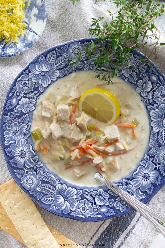 creamy lemon chicken orzo soup recipe in transferware bowl