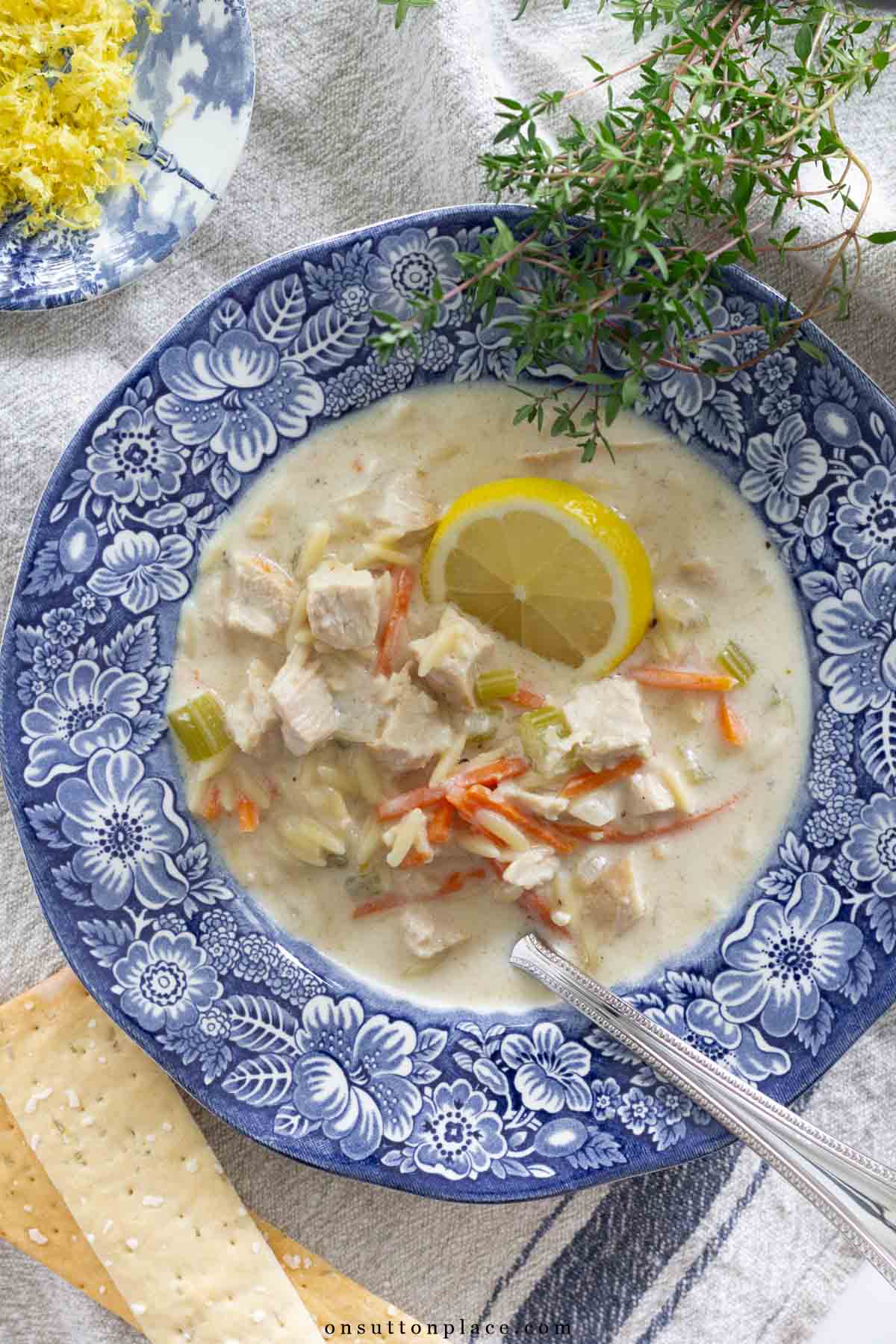 creamy lemon chicken orzo soup recipe in transferware bowl