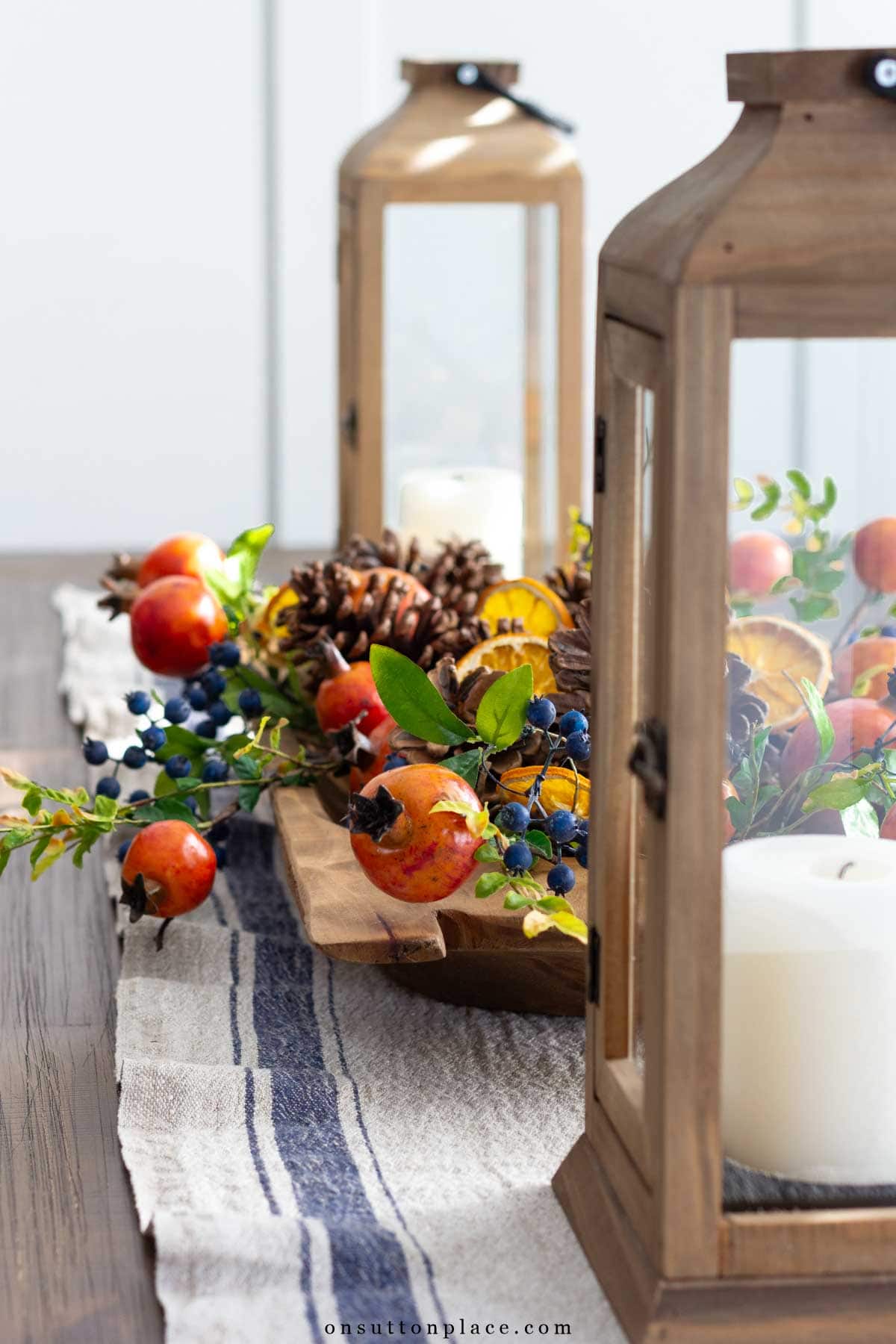 holiday centerpiece in dough bowl with lanterns