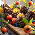 holiday centerpiece pinecones dried orange slices tall pin