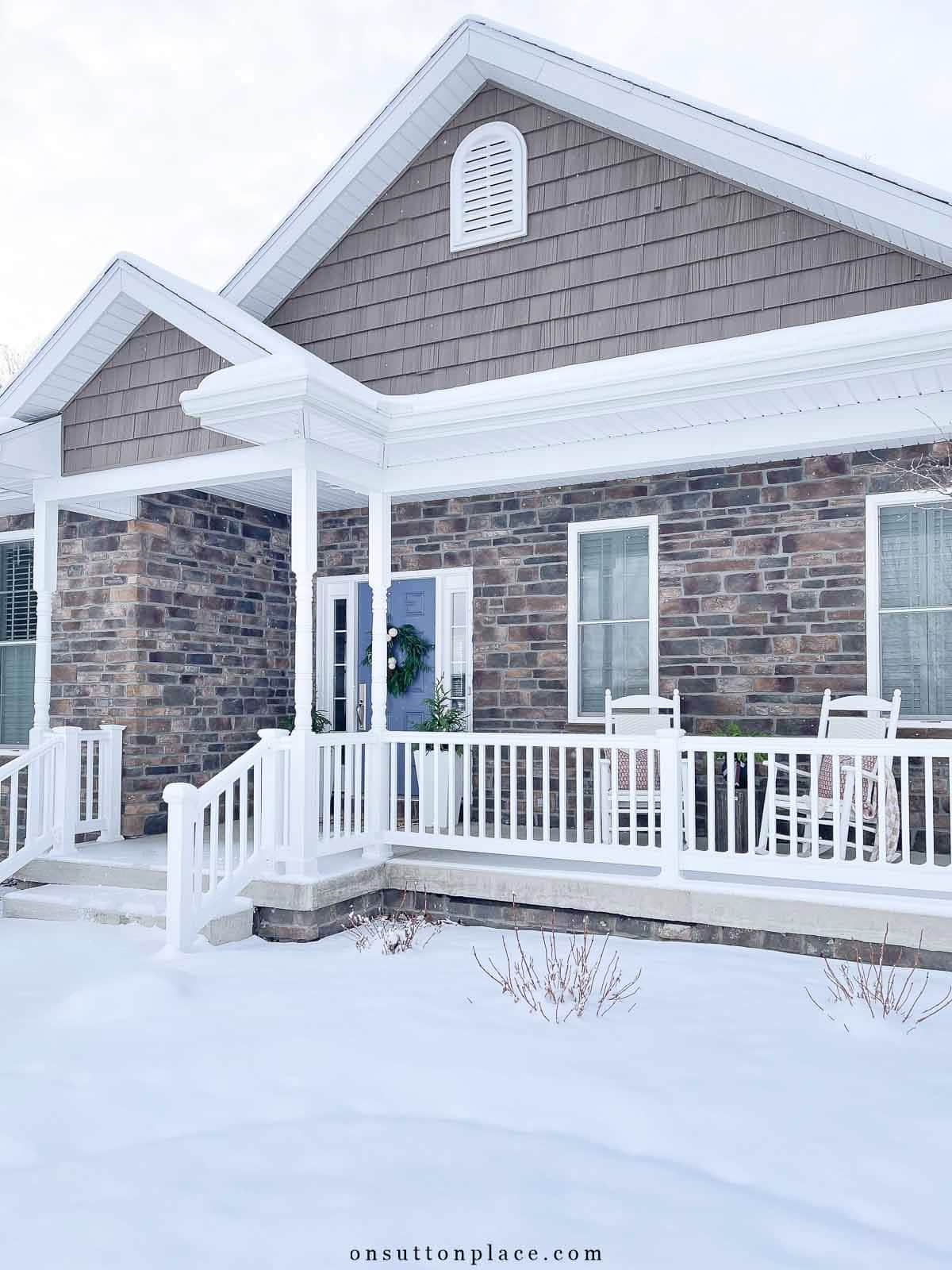 front of house with snow christmas 2025