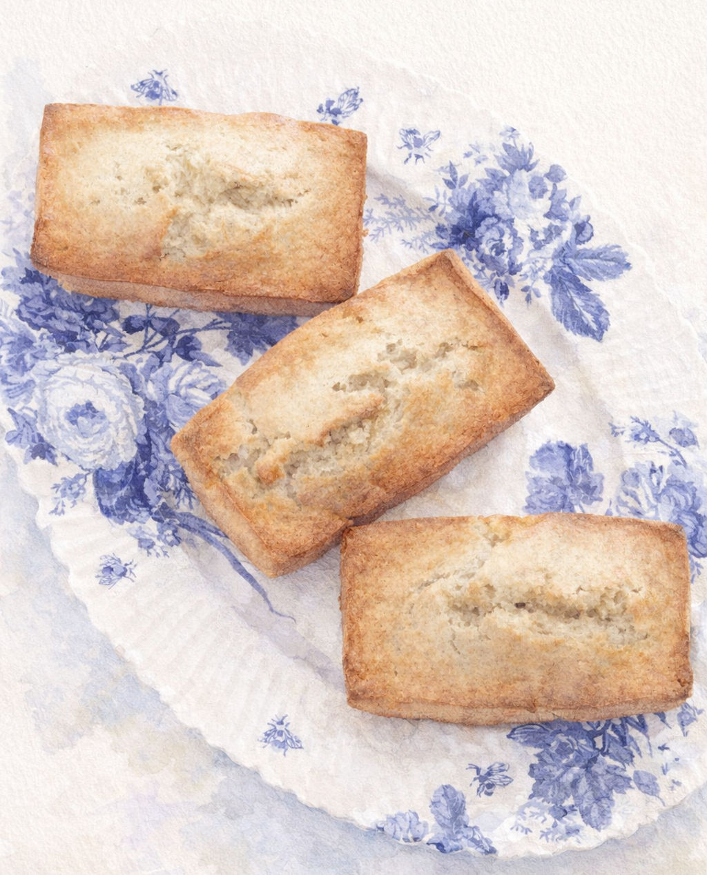 banana bread loaves on blue and white plate watercolor