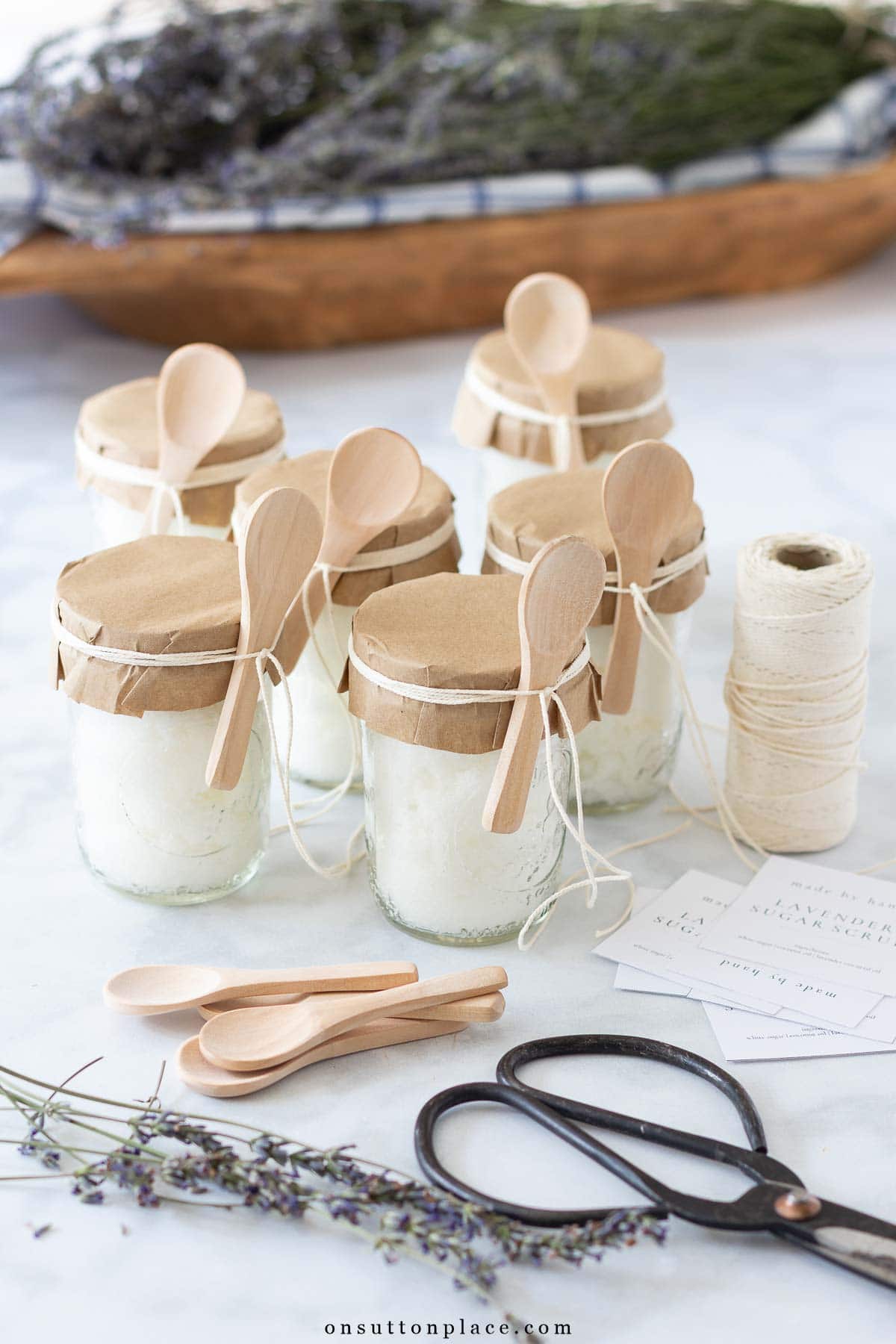 homemade sugar scrub recipe in mason jars with paper embellishment_