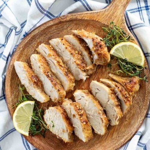 lemon chicken recipe sliced on wood board