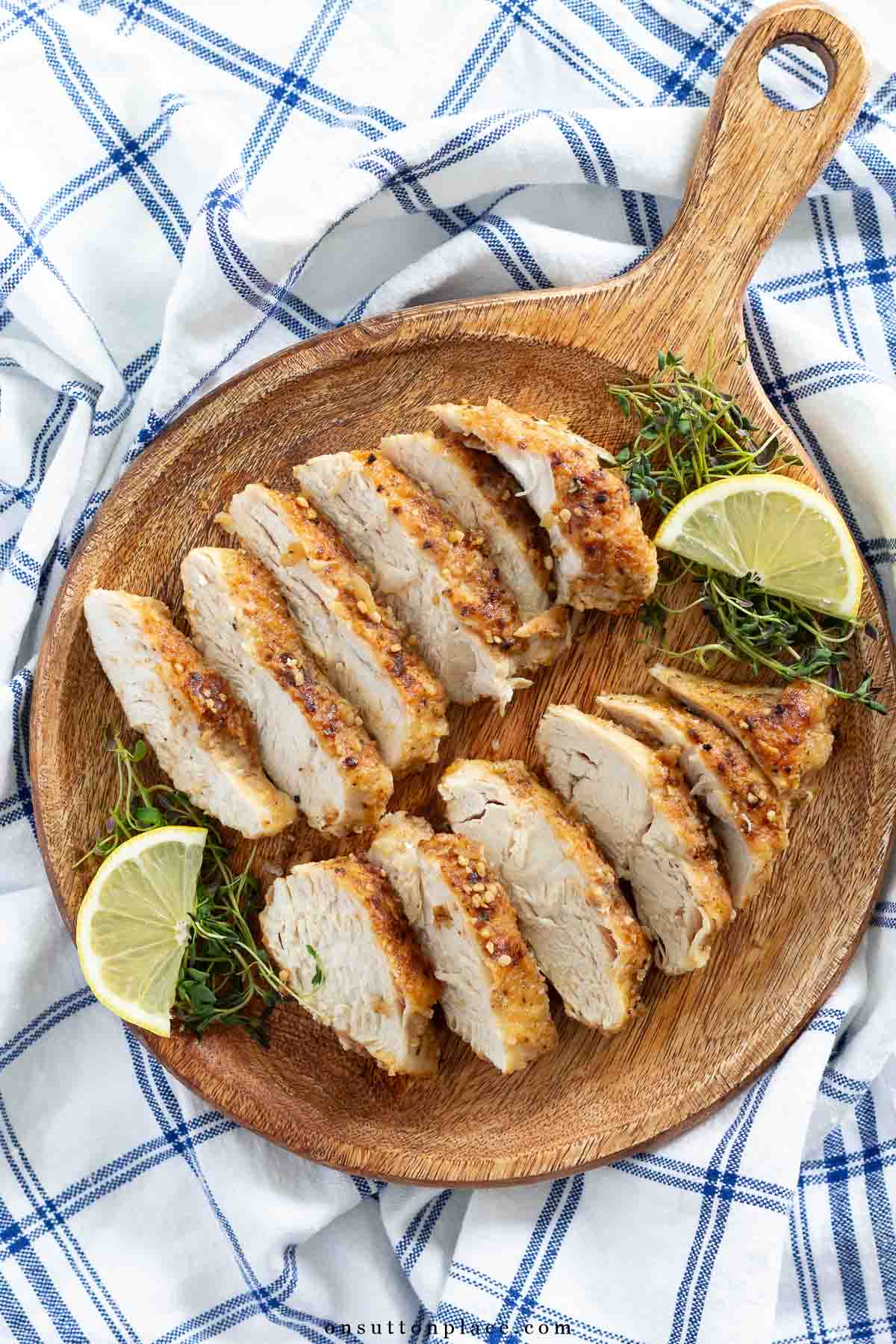 lemon chicken recipe sliced on wood board