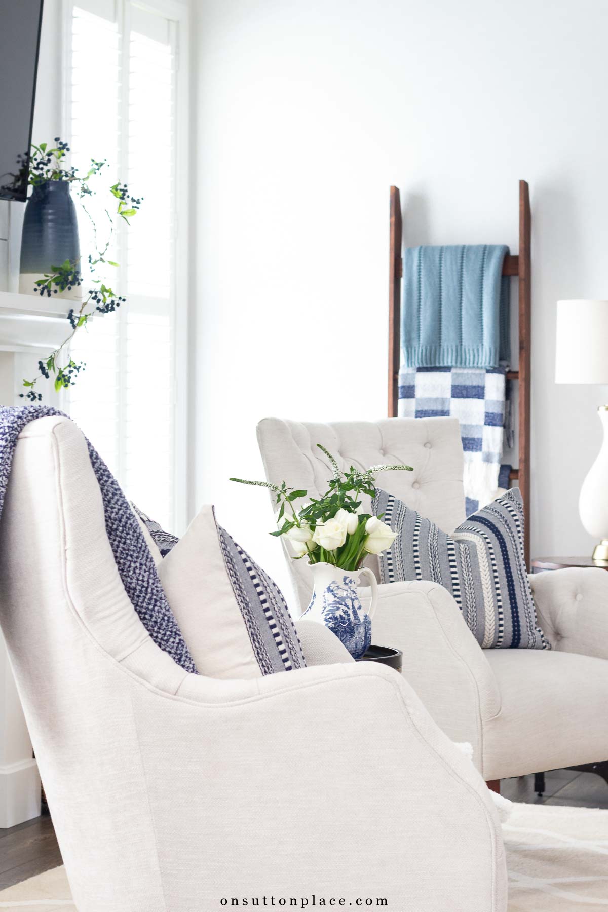 neutral chairs in living room blanket ladder