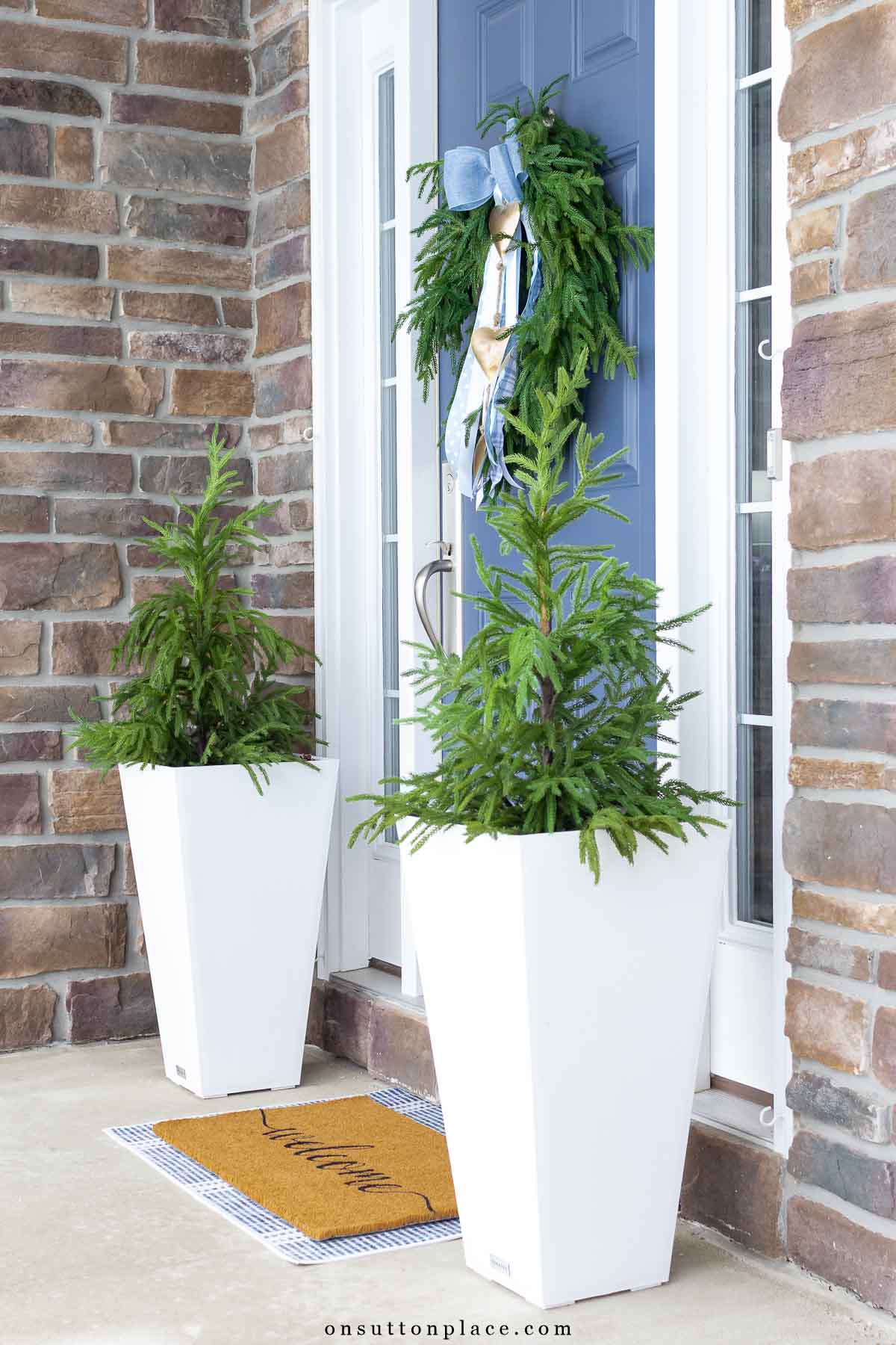 winter front porch ideas blue bow on evergreen wreath