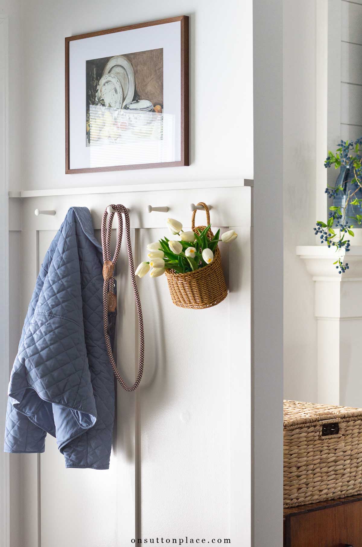 a well kept home jacket on hooks with dog leash