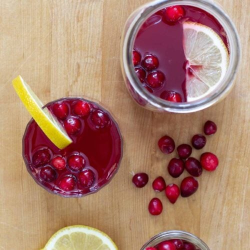 detox cleanse drink with cranberry juice and fresh cranberry garnish