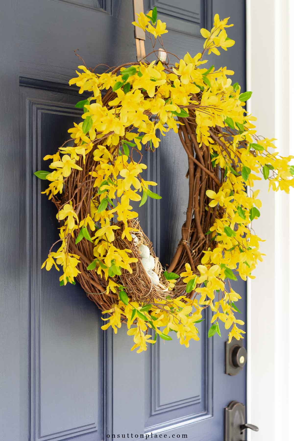 diy spring forsythia front door wreath navy blue door