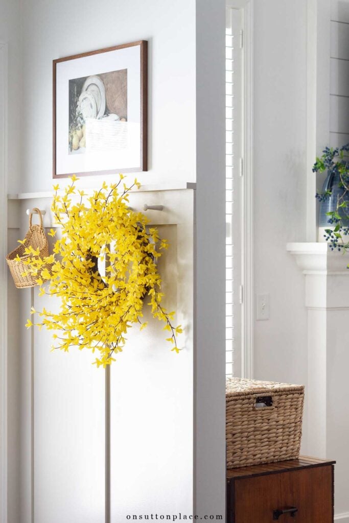 forsythia wreath on board and batten wall
