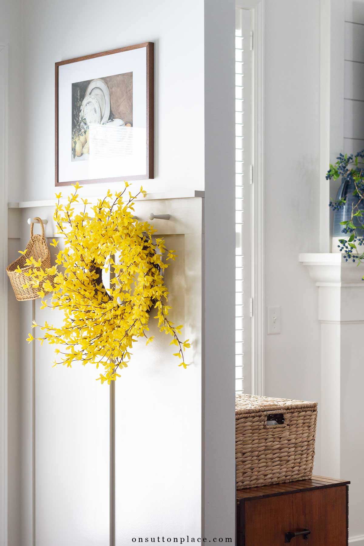 forsythia wreath on board and batten wall