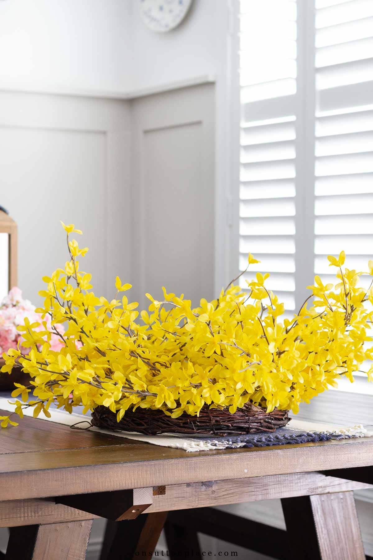 forsythia wreath on table to see fluffing method