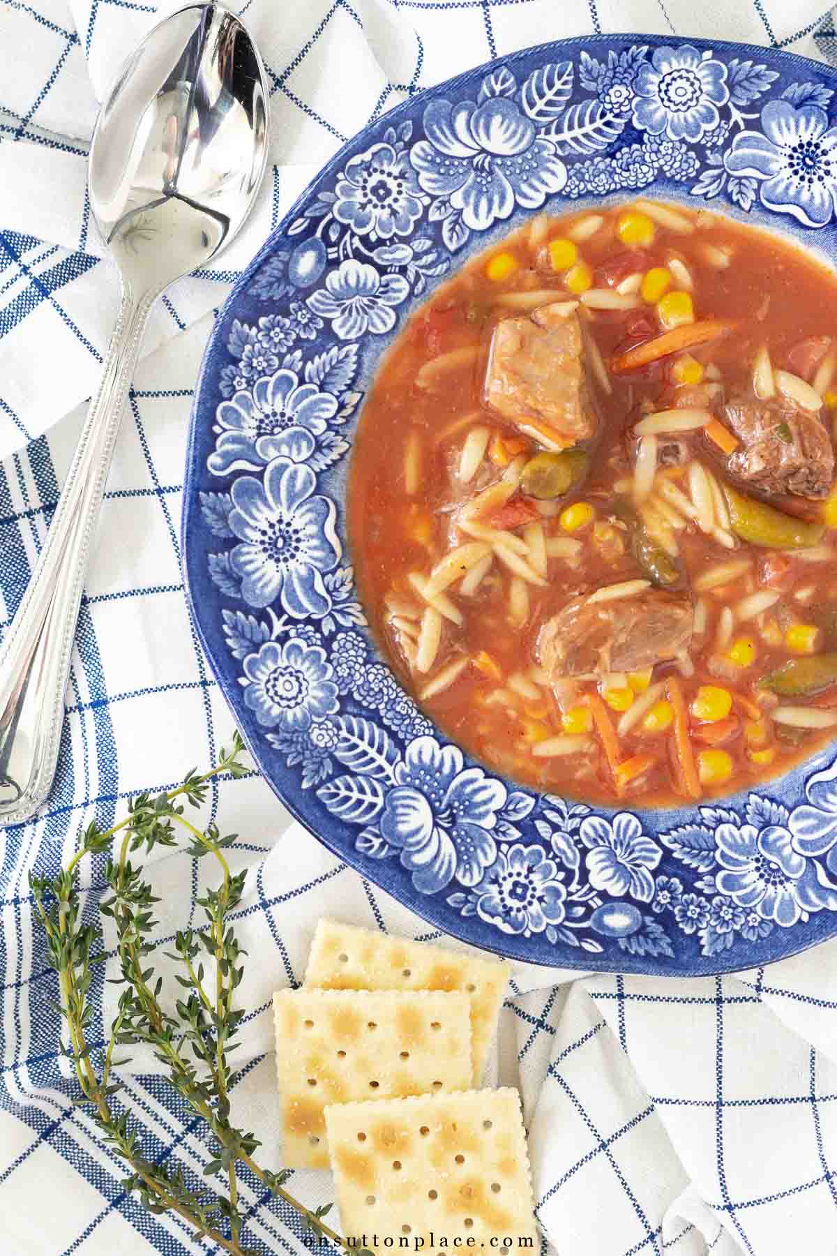 vegetable beef soup recipe in blue transferware bowl for the curated life