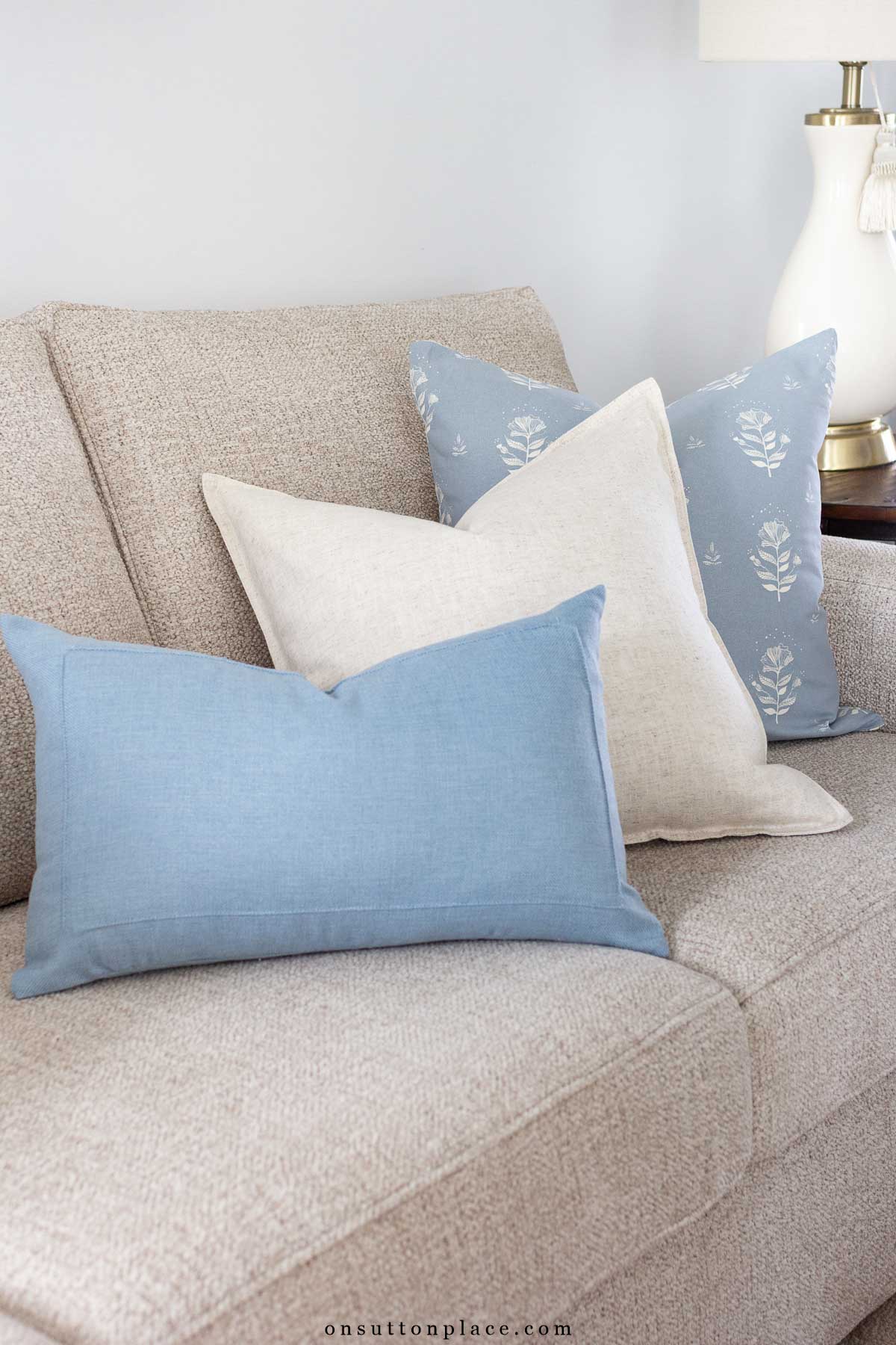 asymmetrical mismatched pillows on sofa