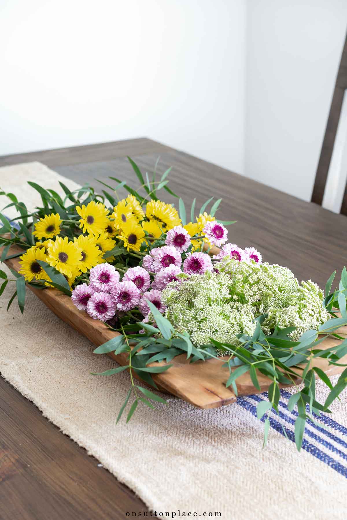 reproduction dough bowl with flowers on dining table
