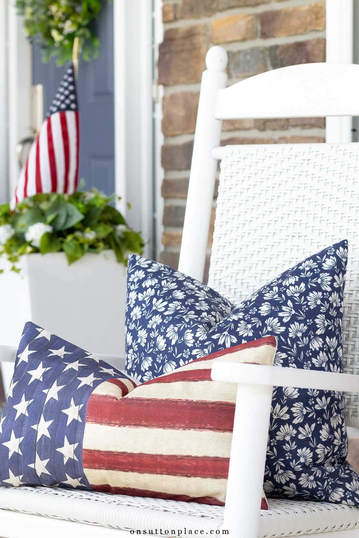 blue floral pillow with flag pillow on rocker