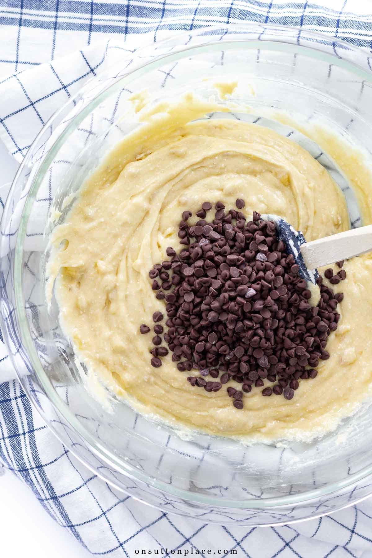 chocolate chip banana bread batter in bowl with chocolate chips