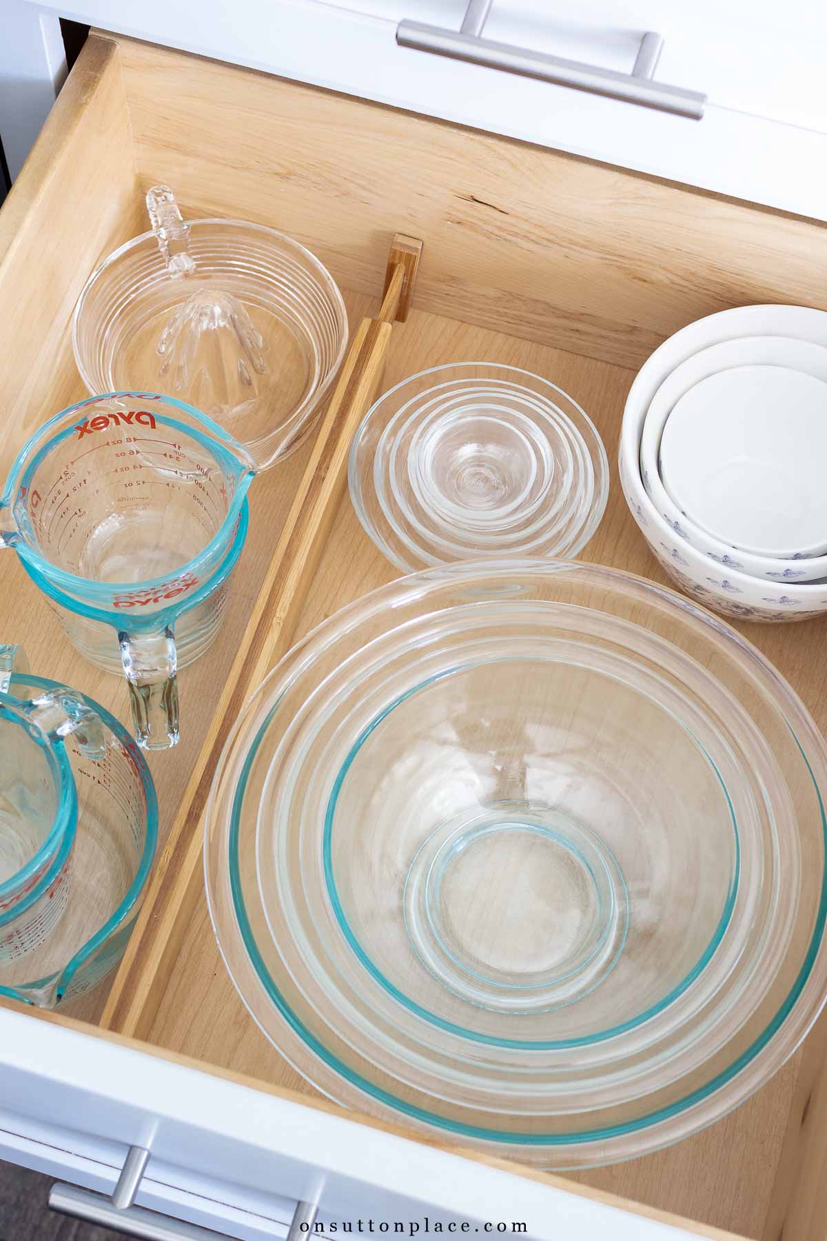 drawer divider used to organize kitchen drawer