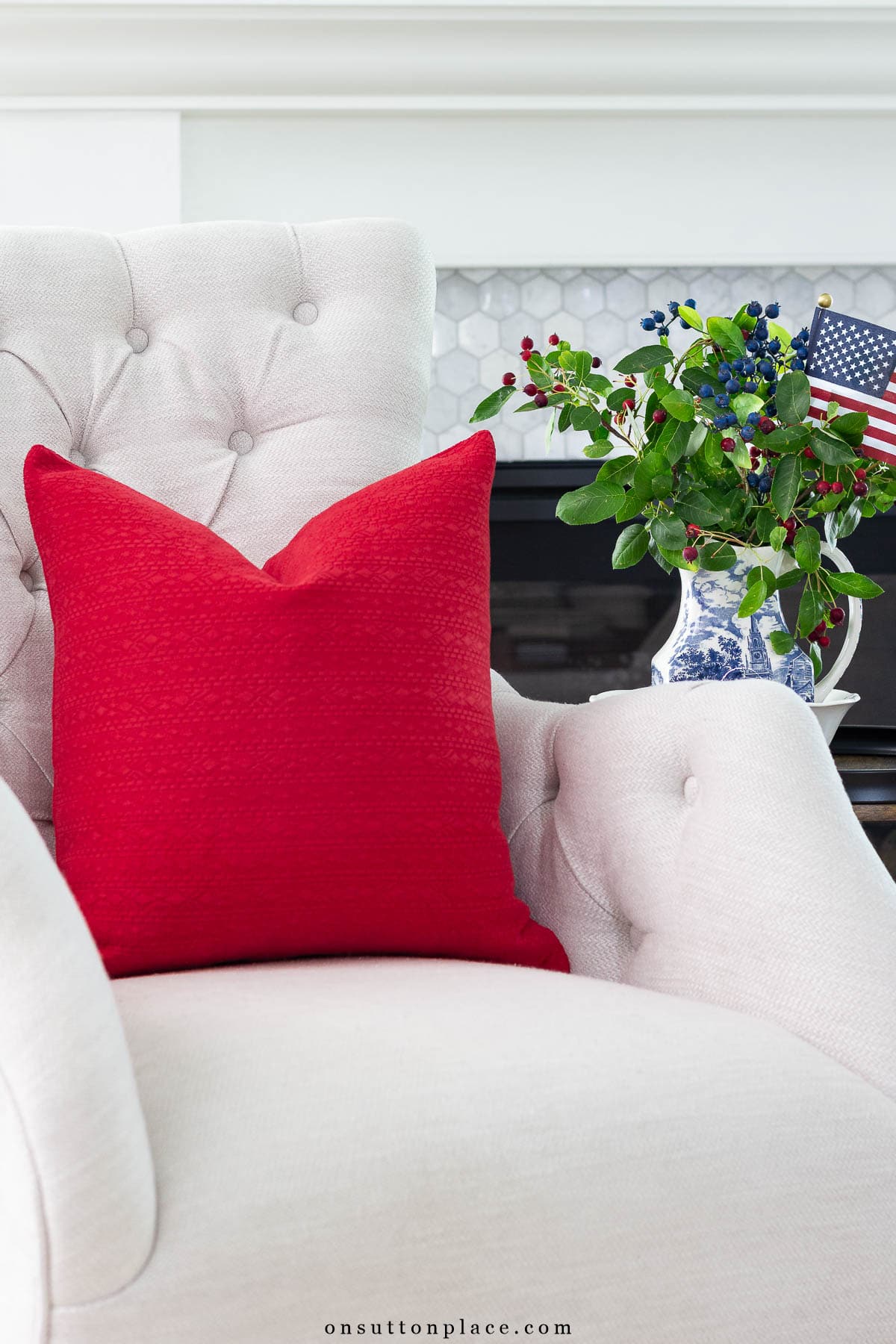 patriotic home decor red pillow on tufted chair