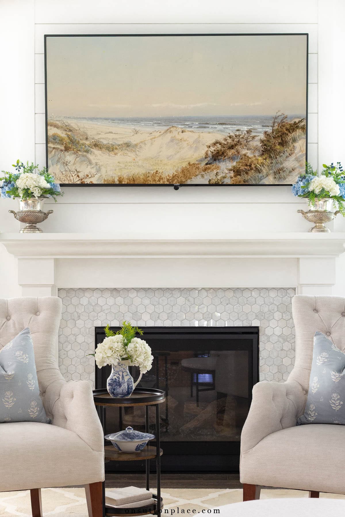 mantel with tv silver urns with hydrangeas