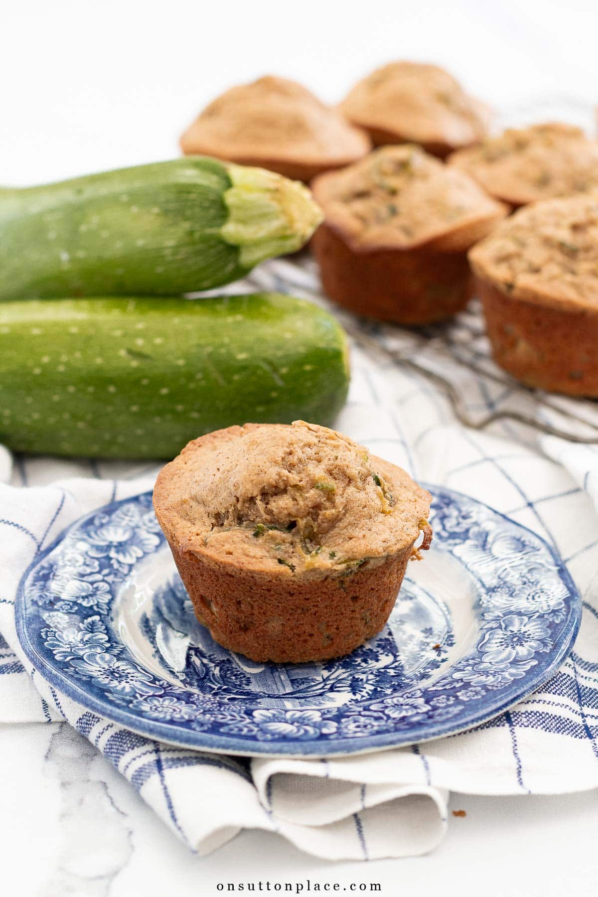 zucchini muffins recipe one muffin on plate